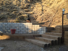 In addition to the stairs and fence, we also built the retaining wall to the left to catch the hill
erosion.