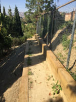 With this hill's slope and steepness, as well as how uneven the land was, this entire area was simply unaccessible before we came in. We created a custom walkway using two lines of timbers and now it's a usable pathway for the property owners.