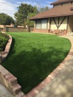Synthetic Lawn with rock planter we designed.